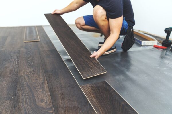 laminate flooring worker installing new floor